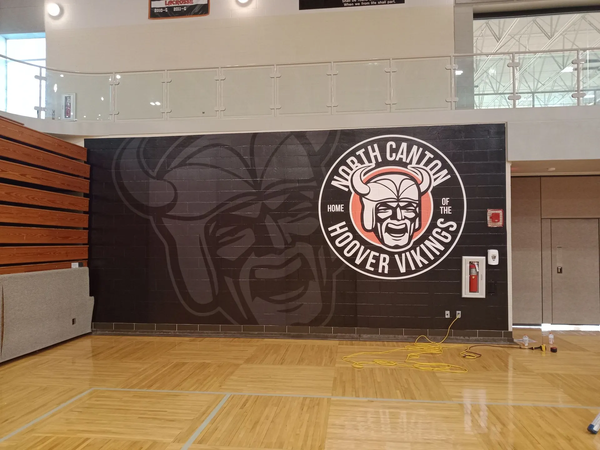 A bold graphic wrap installed across a concrete block wall